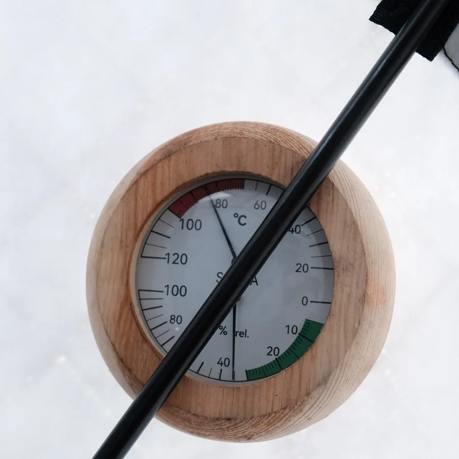 The thermometer inside the beach sauna